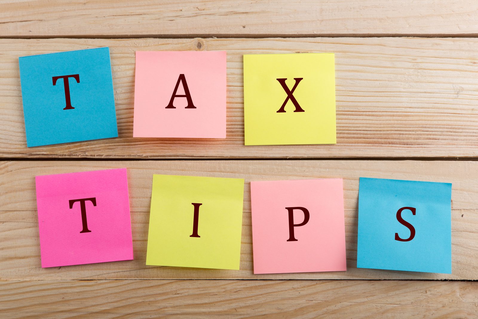 Sticky notes spelling out "Tax Tips"