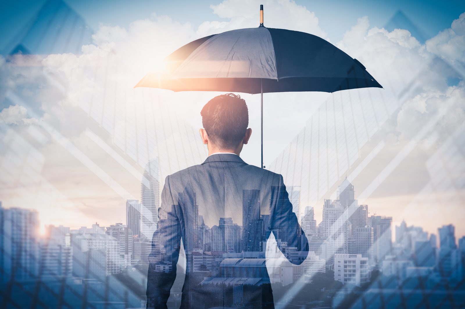 Man in metropolitan city holding umbrella